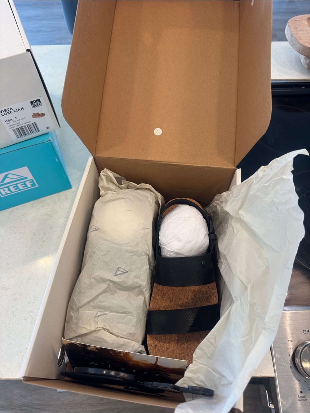 Reef Women’s Black and Brown Leather Slide Sandals